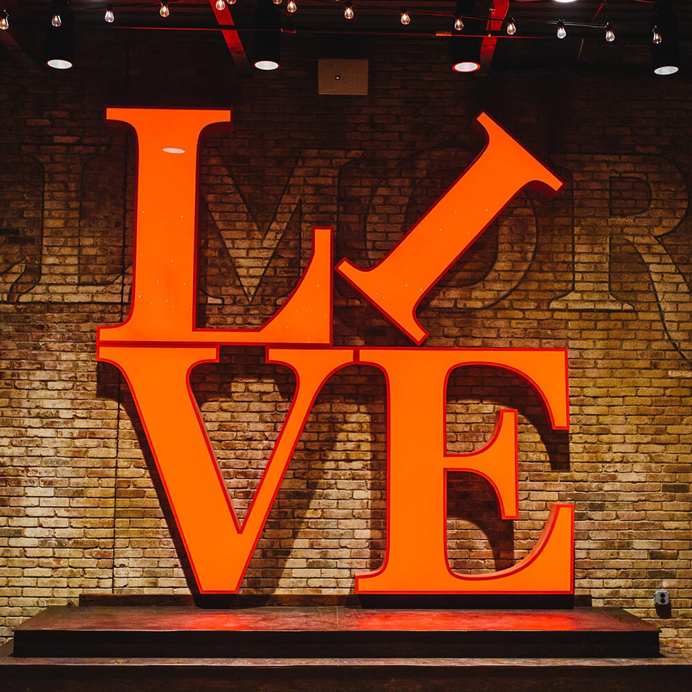 The Fillmore LOVE signage with brick wall in background